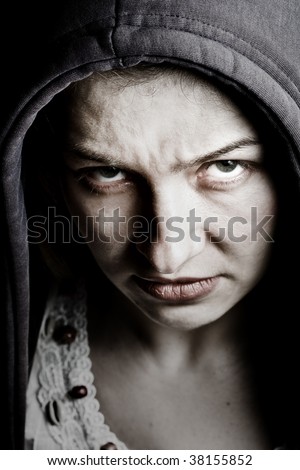 Scary sinister woman with evil eyes