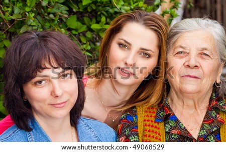 Family portrait - happy daughter granddaughter and grandmother