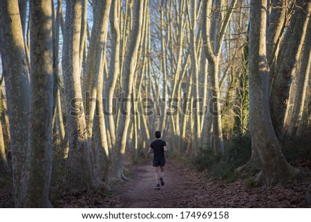 boy running in the natural place