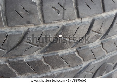 Tires flat with  tack, Tack puncture tires, Close up nail puncturing,jammed in tire