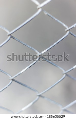 Old iron wire fence, close-up wire mesh fence
