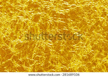 Shiny yellow gold foil texture background