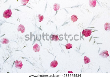 White Sa Paper with roses petals and flowers of grass  background, Sa Paper is hand made paper from parish Bosang province Chiang Mai north of Thailand, Mulberry paper texture background