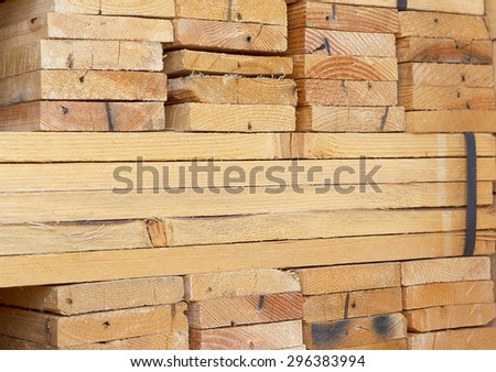 Background of Stacked Wood Cut in Squared Timber