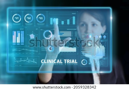 Business, Technology, Internet and network concept. Young businessman working on a virtual screen of the future and sees the inscription: Clinical trial ストックフォト © 