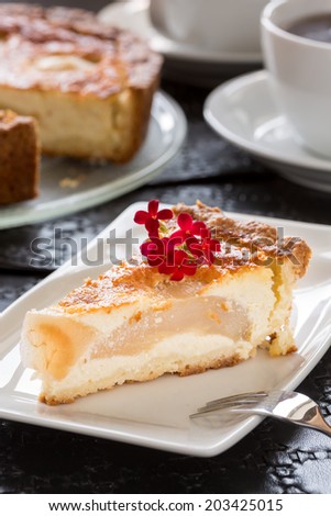 a piece of pear pie on white plate