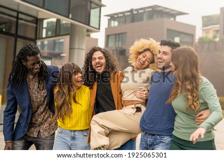 multiracial group of friends walking and having fun together, millennials people smiling and laughing in city context, social diversity people from the world Photo stock © 