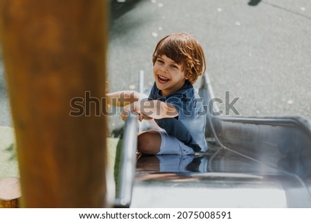 Similar – Image, Stock Photo metallic slide on the playgroundo on the street in Bilbao city Spain