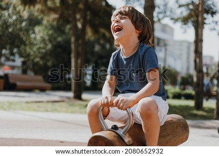 Similar – Image, Stock Photo Child playing on playground