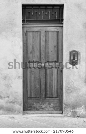 Wooden, house door in Tuscany region  (black and white)
