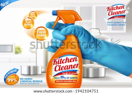 3d kitchen cleaner spray ad template. Realistic orange spray bottle held in hand on blurry white kitchen counter background.
