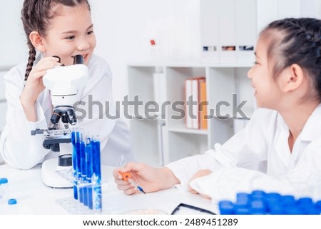 Similar – Image, Stock Photo Concentrated and enthusiastic girl plays table hockey.