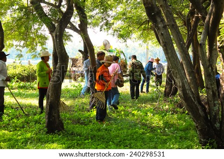 MAHASARAKHAM,THAILAND - SEPTEMBER 19 : Teachers and students together to clean the park on September 19,2014 in Mahasarakham,Thailand