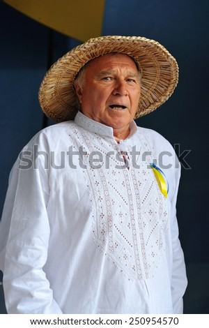 KIEV, UKRAINE - AUGUST 24: Old man in national clothes standing backstage and awaiting for his performance and it is seen that he is very excited - All Ukrainian Vyshyvanka Parade in Kiev, Ukraine.