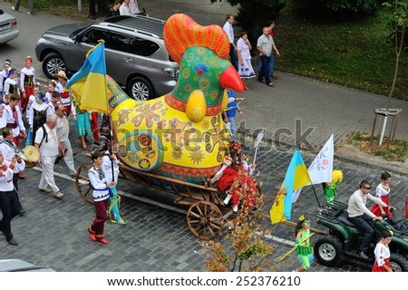 KIEV, UKRAINE - AUGUST 24: People in national costumes and the wonderwork-bird at the All Ukrainian Vyshyvanka Parade on Maidan at Independence Day on August 24, 2013 in Kiev, Ukraine.