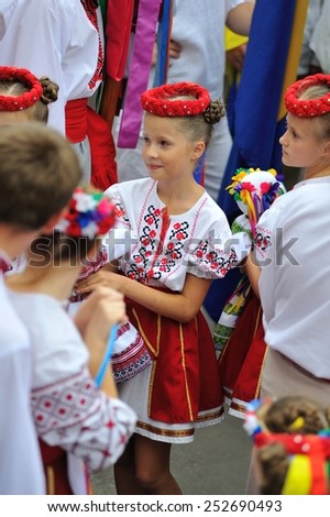 KIEV, UKRAINE - AUGUST 24: A beautiful young lady in national embroided shirt at All Ukrainian Vyshyvanka Parade at Independence Day on August 24, 2013
