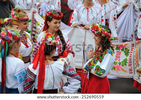 KIEV, UKRAINE - AUGUST 24: Young and beautiful ladies in national embroided shirts at All Ukrainian Vyshyvanka Parade at Independence Day on August 24, 2013