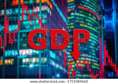 Inscription GDP against background of skyscrapers. Walls of night skyscrapers. Logot GDP next to falling chart. Concept - drop of world GDP. Concept - negative forecasts in economy. Domestic product 商業照片 © 