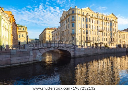 Canals of Saint Petersburg. Architecture of Russia. Bridge over the canal in Saint Petersburg. Winter bridge on a summer day. Panorama of Saint Petersburg with a bridge. Guide to Russia.