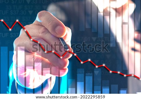 Trader is manipulation value of stock. He betting on a decline in stocks. Broker works with short positions. Shorting in investments. Declining line of stock next to investor. Fin stock manipulation 商業照片 © 