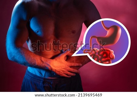Healthy intestines. Man with healthy intestine and feel comfortable. Dysbiosis and colic prevention. Human anatomy and physiology. Intestine mockup against the background of man figure. 商業照片 © 