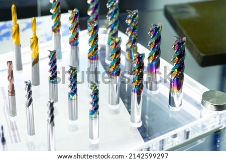 CNC cutters for metal. Multi-colored drills close-up. Accessories for engraving, milling, cutting of various metals. Cutters of different types. Monolithic milling tool. Solid carbide milling cutters Сток-фото © 