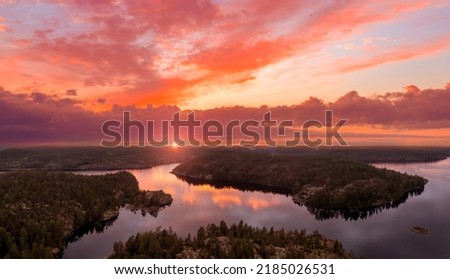 Similar – Foto Bild Sonnenuntergang über Bergen mit verschneitem Wald