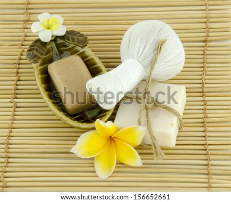 Frangipani, yellow, red Frangipani flowers and spa stones with flowers placed on the floor and white.