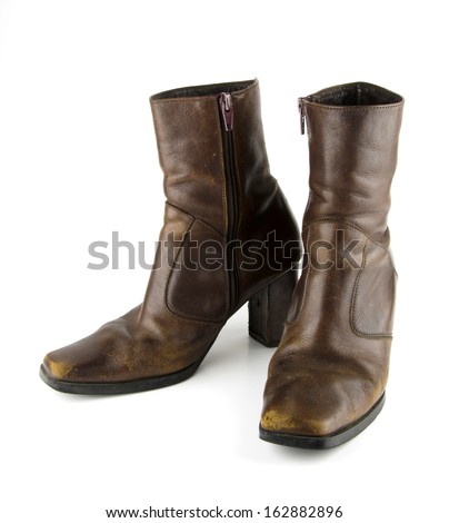 Brown leather boots with a heel, but not very high abrasion of the film, which shows how many times the old used to wear it on a white background.