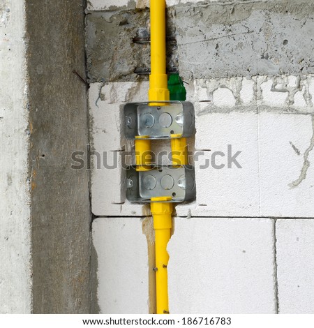 PVC pipe for electrical boxes and wires buried in walls to block.
