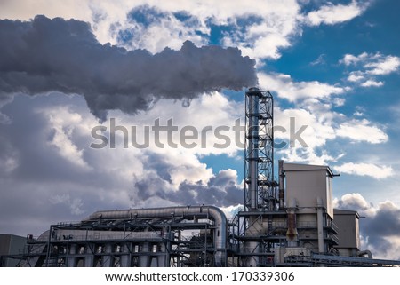 Factory with chimney and smoke