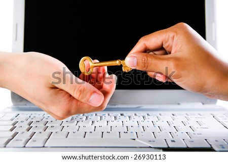 Handing over the golden key, both hands are over the laptop.