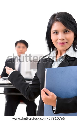 A woman employee welcoming a guest to come in.