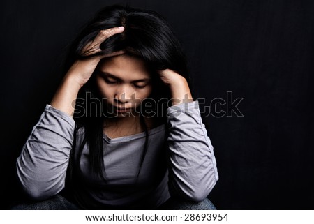 Frontal photo of young stress woman against dark wall