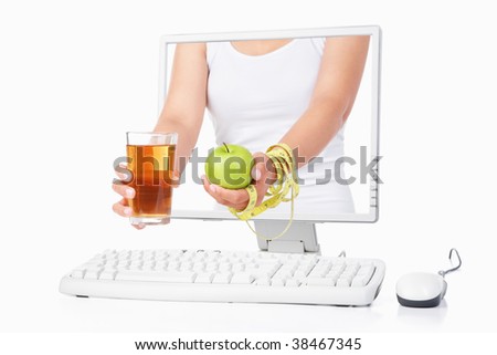 Female hand holding green apple and a glass of juice with measuring tape coming out from computer screen isoalted over white background