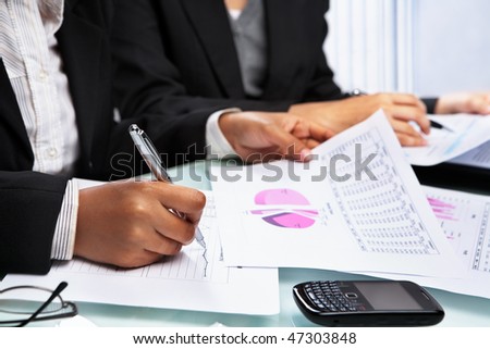 Asian Businesswomen working and analyzing data and statistic