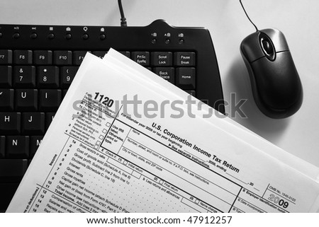 Online tax from concept using tax form, keyboard and mouse