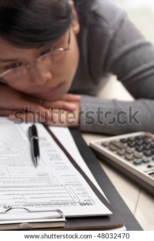 Woman stress with tax form, who don\'t know what to do