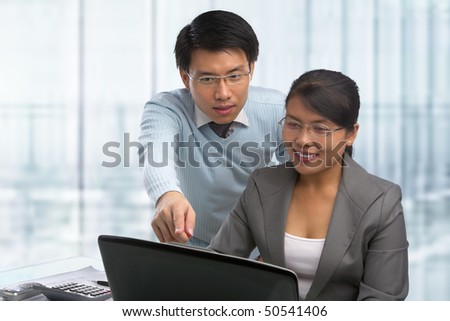 Asian business people working together in office