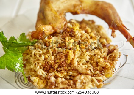 Instant fried noodle with scramble egg and fried chicken