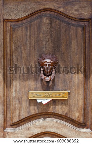 Similar – Image, Stock Photo old, pasted mailbox slot with a flap that says “LETTERS”, made of metal in an old wooden door, where the brown paint is peeling off / write letter / e-mail / mailbox company