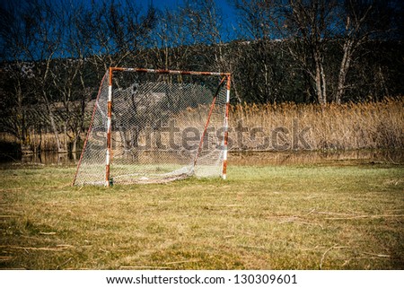 Neglected football playground and goalpost