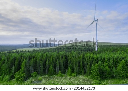 Similar – Image, Stock Photo Trees and wind turbines at dawn