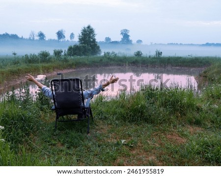 Similar – Image, Stock Photo Man resting in water with guitar at seaside