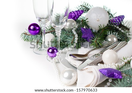 Festive Christmas table setting, table decoration in purple tones, with fir branches, Christmas balls on a white background, isolated