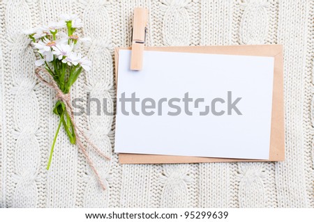 Empty cardboard card with flowers and an envelope