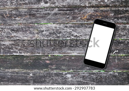 Smartphone on wood background with copy space and text space