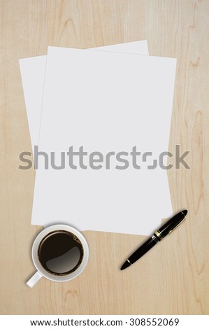 Blank paper page, note paper,coffee, cup with pen on wood table with text space