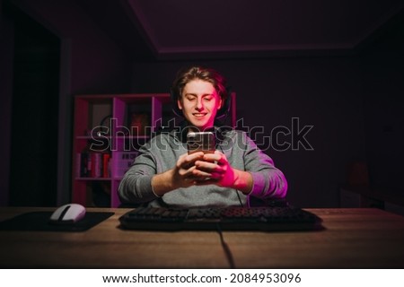 Similar – Image, Stock Photo Man using his smartphone sitting on a ledge outside