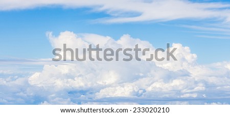 Close-up big fluffy clouds in light blue sky, beautiful cloudscape.